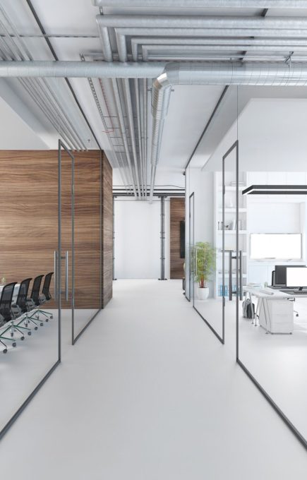 Modern office interior, many work stations with desktop computer and large LCD screen. White floor and minimalist materials. no people, template copy space render